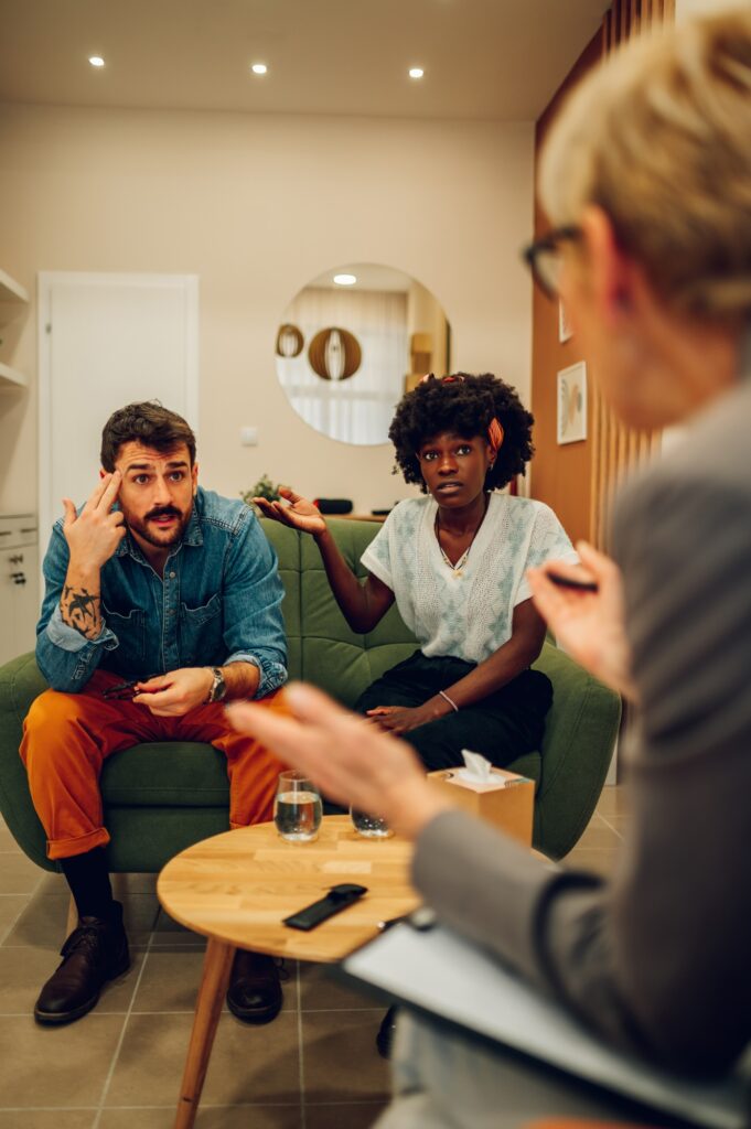 Diverse couple on a therapy session in a psychologist office